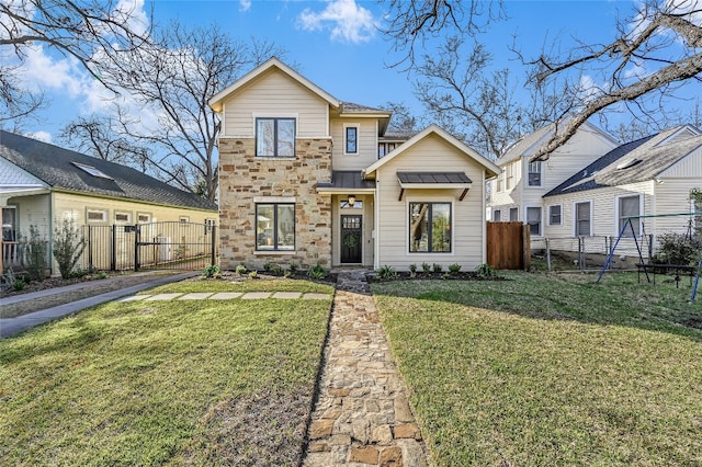 view of front of property with stone siding, a gate, fence, and a front lawn