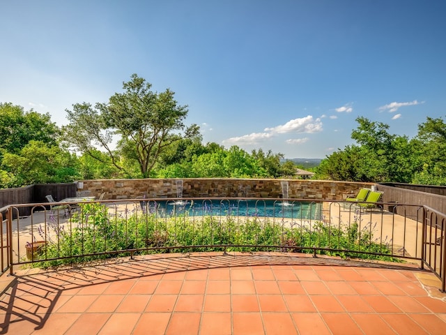 view of patio with fence and a fenced in pool