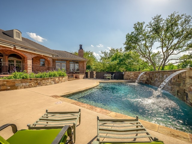 view of pool with a fenced in pool, a fenced backyard, and a patio