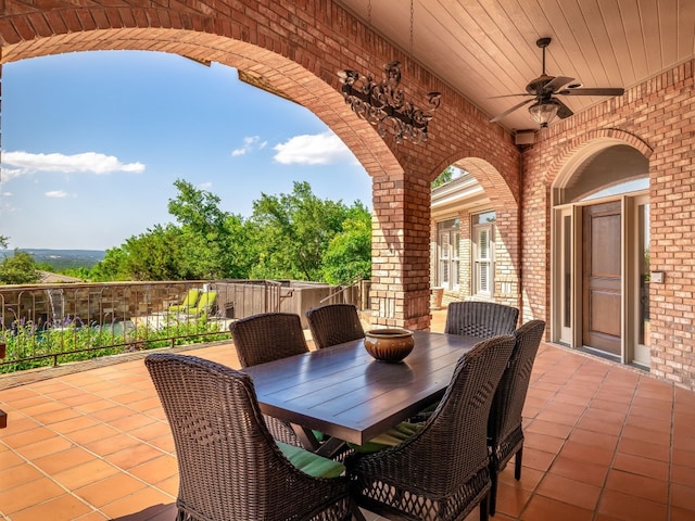 view of patio / terrace with outdoor dining space and a ceiling fan