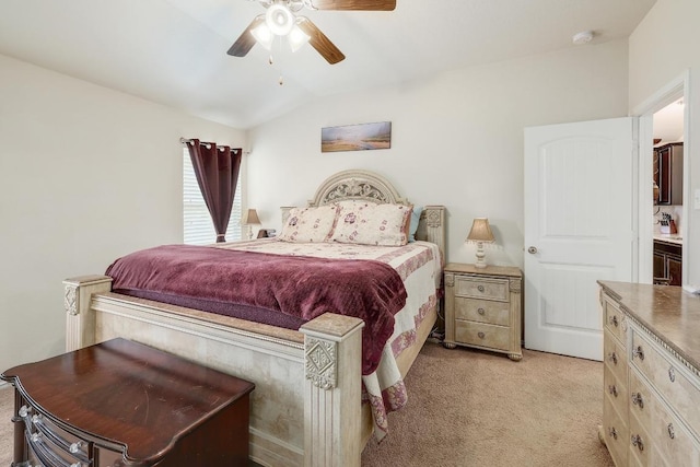 bedroom featuring lofted ceiling, a ceiling fan, and light colored carpet