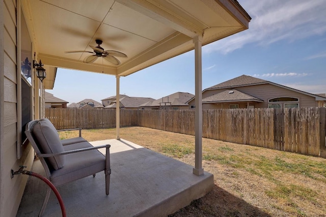 view of patio / terrace with a fenced backyard and ceiling fan