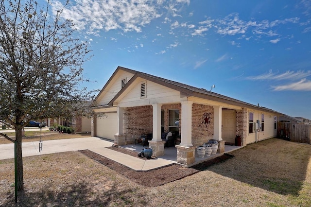 view of front of home featuring brick siding, a porch, concrete driveway, fence, and a garage