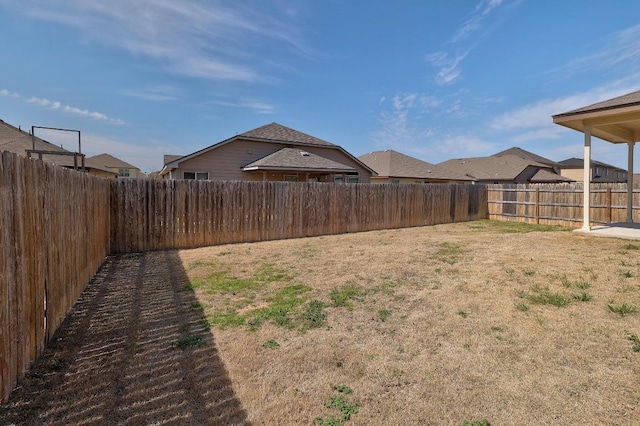 view of yard with a fenced backyard