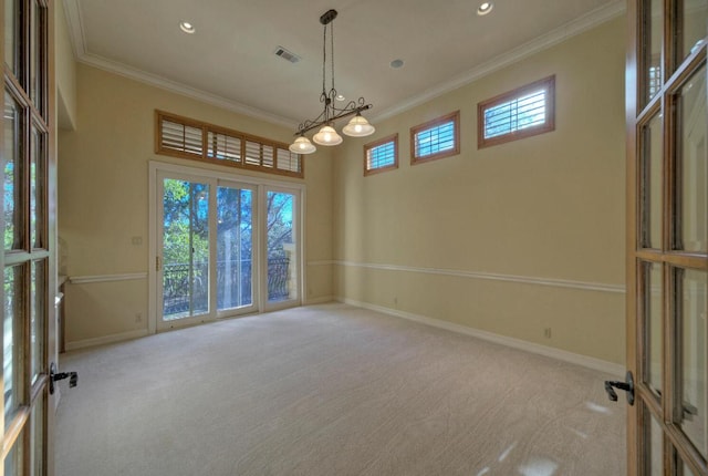 carpeted spare room with ornamental molding, recessed lighting, visible vents, and baseboards