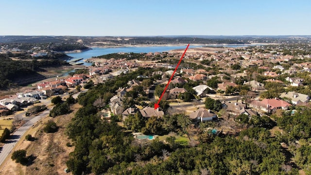 birds eye view of property featuring a water view and a residential view