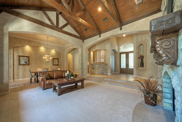 carpeted living area with high vaulted ceiling, wood ceiling, arched walkways, and beamed ceiling