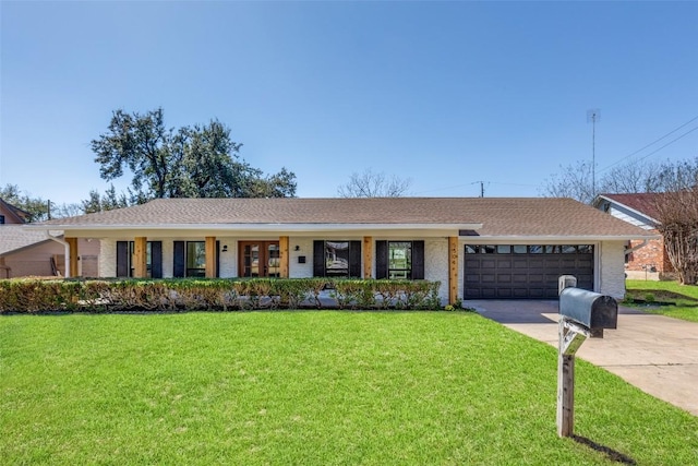 single story home with a garage, a front lawn, concrete driveway, and brick siding