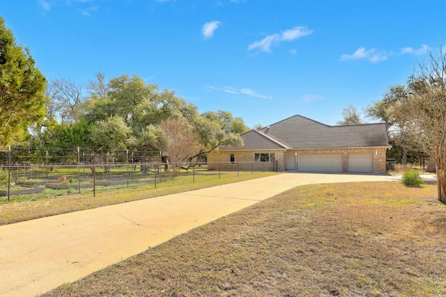 single story home with an attached garage, brick siding, fence, concrete driveway, and a front lawn