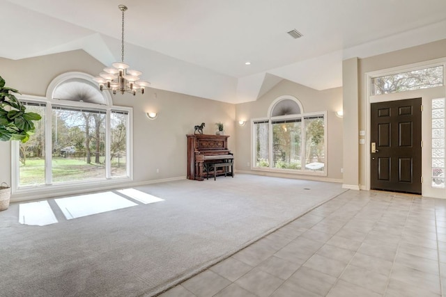 foyer entrance featuring a chandelier, light colored carpet, visible vents, and baseboards