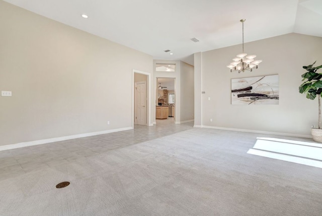 empty room featuring light carpet, baseboards, lofted ceiling, and an inviting chandelier