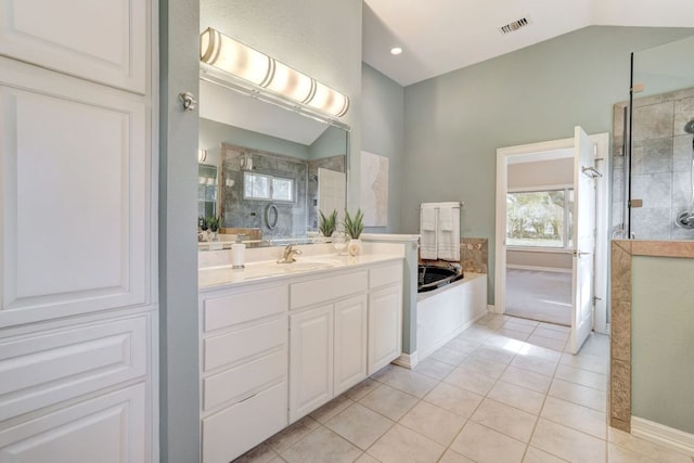 full bath featuring lofted ceiling, visible vents, vanity, a shower stall, and tile patterned floors