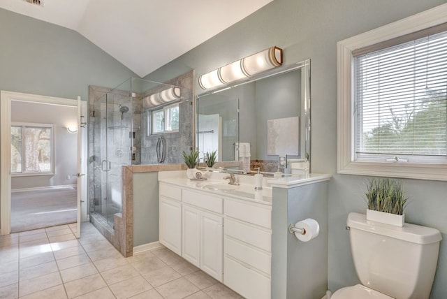 full bath with toilet, a stall shower, vaulted ceiling, vanity, and tile patterned floors