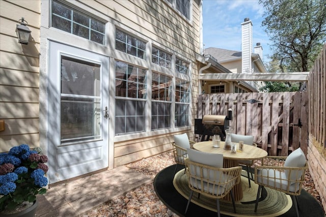 view of patio / terrace featuring fence