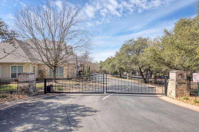 view of gate featuring fence