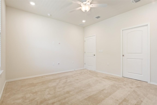 spare room with baseboards, visible vents, light colored carpet, ceiling fan, and recessed lighting