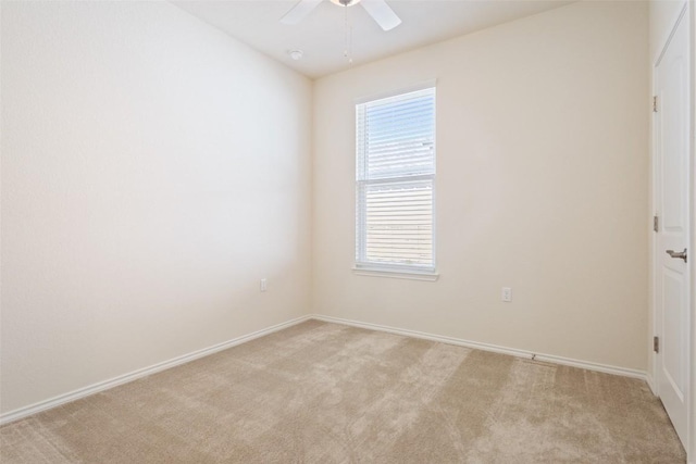 unfurnished room with light carpet, ceiling fan, and baseboards