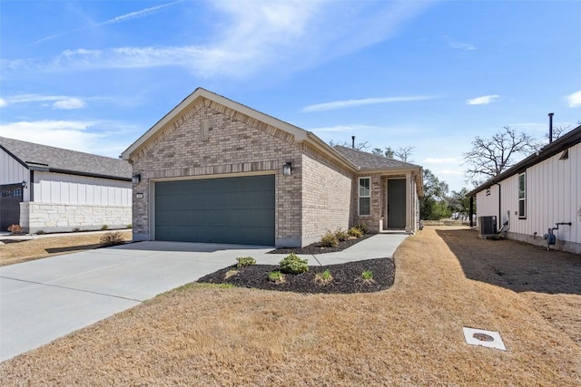 ranch-style home with an attached garage, central AC, concrete driveway, and brick siding