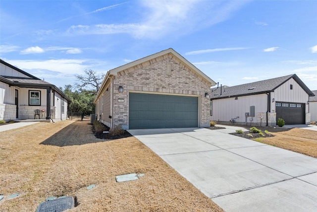 view of front of property featuring brick siding, driveway, and an attached garage