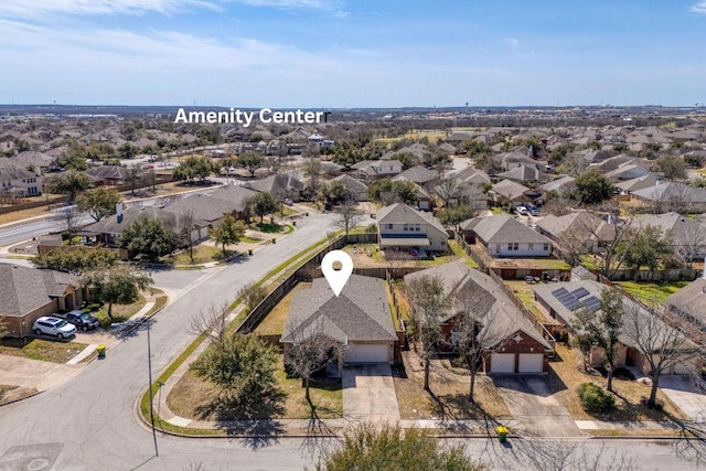 birds eye view of property with a residential view