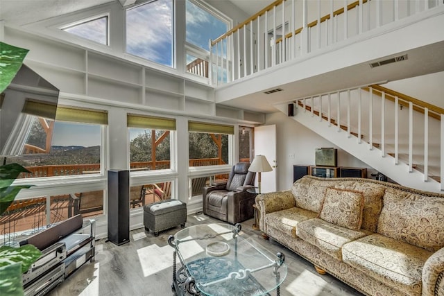 sunroom featuring a healthy amount of sunlight and visible vents