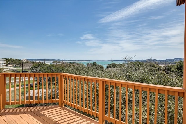 wooden deck with a water view