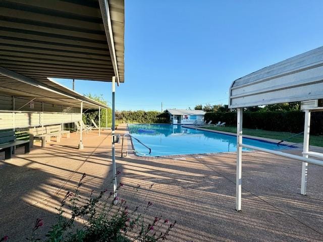 view of pool with a fenced in pool