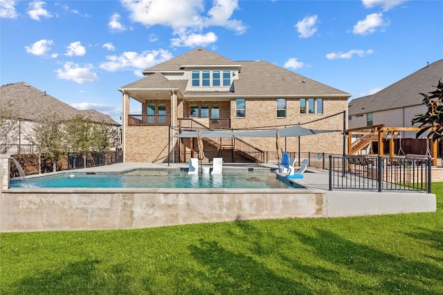 view of pool featuring a fenced in pool, stairs, fence, and a lawn