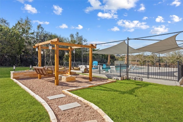 view of property's community with playground community, fence, a pool, and a lawn