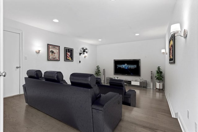 living room featuring baseboards, wood finished floors, and recessed lighting