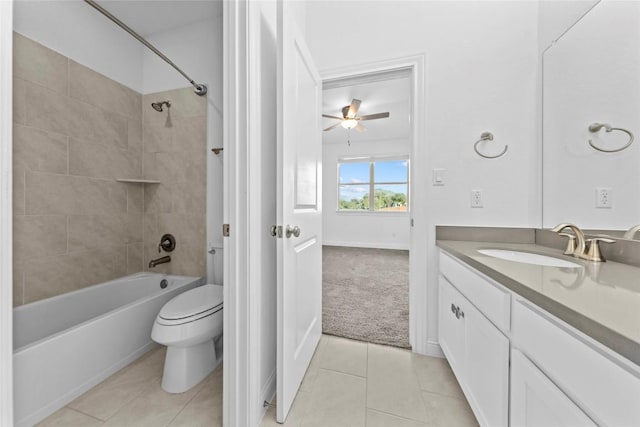 full bath with ceiling fan, tile patterned flooring, toilet, vanity, and shower / bathing tub combination