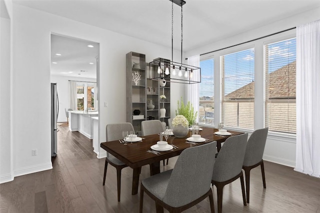 dining space with recessed lighting, dark wood-style flooring, and baseboards