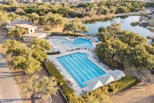 birds eye view of property with a water view