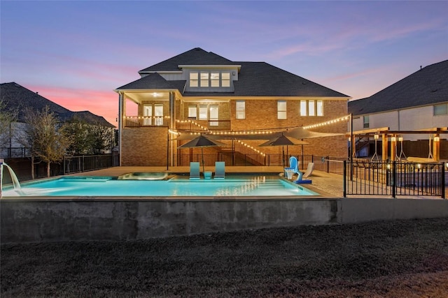 view of pool featuring a patio area, fence, and a fenced in pool