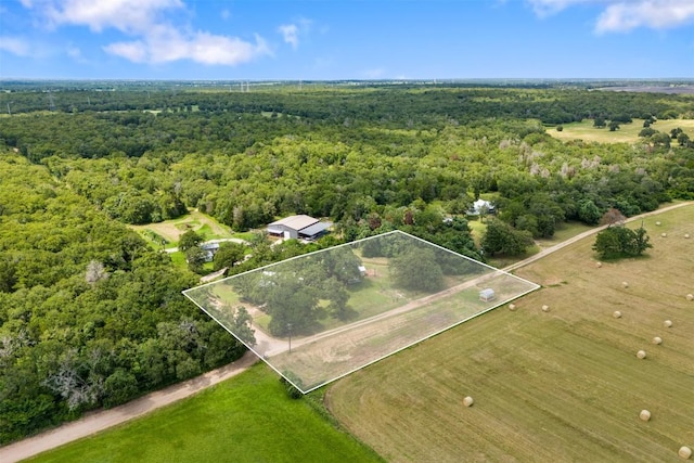 aerial view with a wooded view