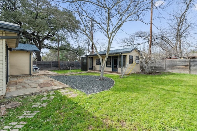 view of yard featuring a patio area and a fenced backyard