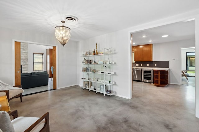 4810 Enchanted Ln, Austin, TX 78745 - dining space with wine cooler, baseboards, a chandelier, recessed lighting, and concrete flooring