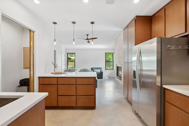 4810 Enchanted Ln, Austin, TX 78745 - kitchen with stainless steel fridge, recessed lighting, light countertops, open floor plan, and finished concrete floors