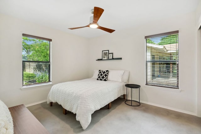 4810 Enchanted Ln, Austin, TX 78745 - bedroom featuring multiple windows, carpet flooring, baseboards, and a ceiling fan