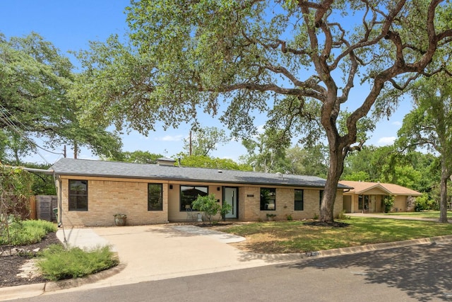 4810 Enchanted Ln, Austin, TX 78745 - single story home with brick siding and concrete driveway