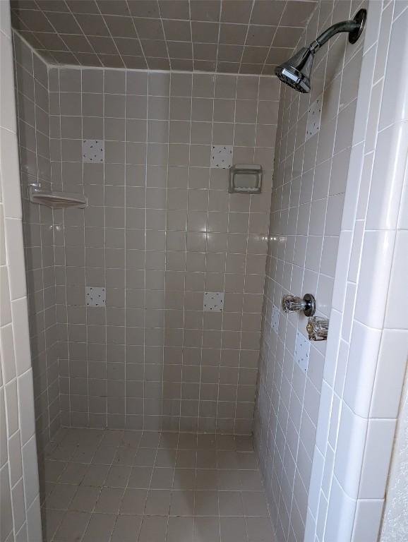 bathroom with a tile shower