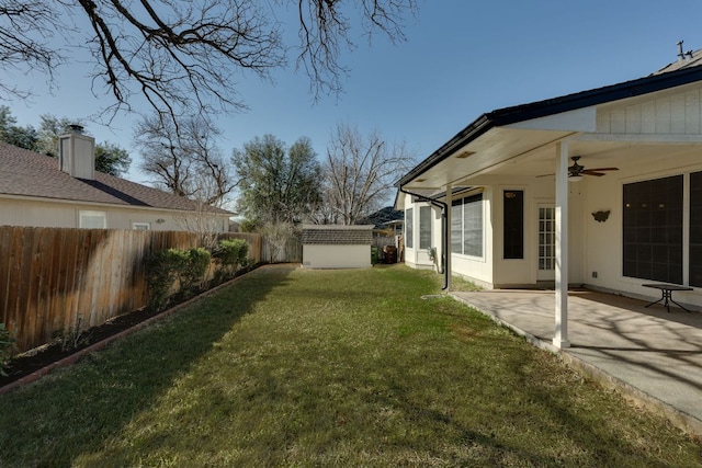 view of yard with ceiling fan, a patio, and a fenced backyard