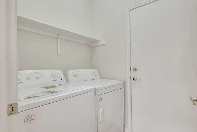 laundry room featuring washing machine and dryer and laundry area