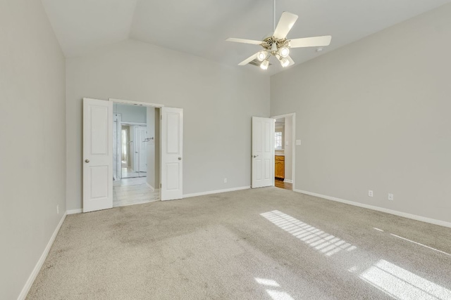 unfurnished bedroom with high vaulted ceiling, carpet flooring, baseboards, and a ceiling fan