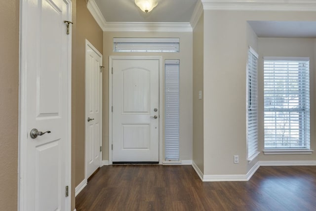 entryway featuring ornamental molding, dark wood finished floors, and baseboards