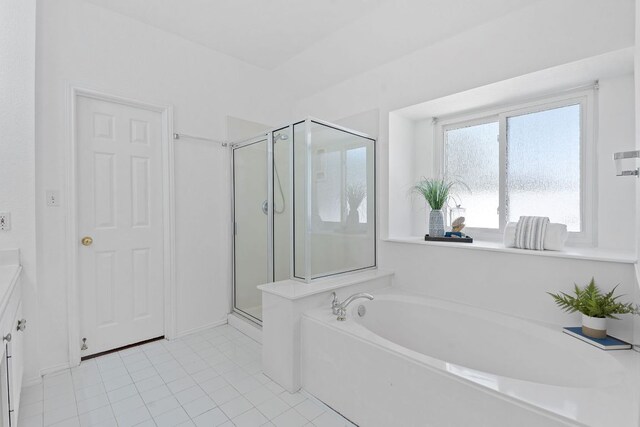 full bathroom with vanity, a shower stall, a bath, and tile patterned floors