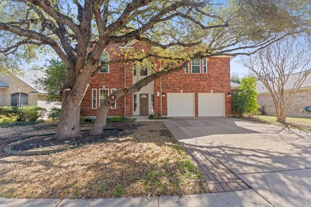 view of front of home with concrete driveway, brick siding, a garage, and french doors