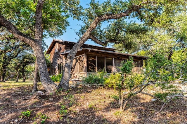 view of home's exterior featuring a sunroom