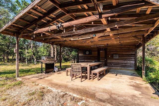 view of patio featuring a grill and outdoor dining space