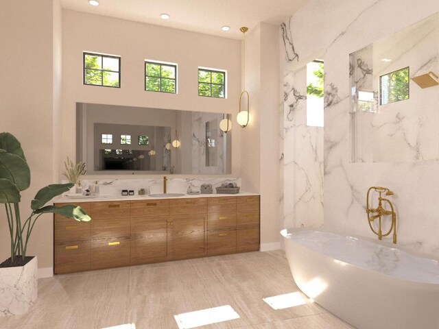 bathroom featuring a soaking tub, vanity, and recessed lighting